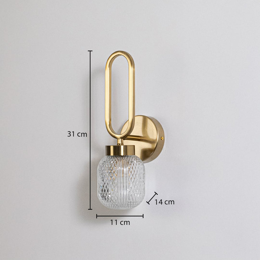 Gold wall sconce with oval loop frame and textured glass shade shown with size 31 cm height 11 cm width 14 cm depth fitting guide.