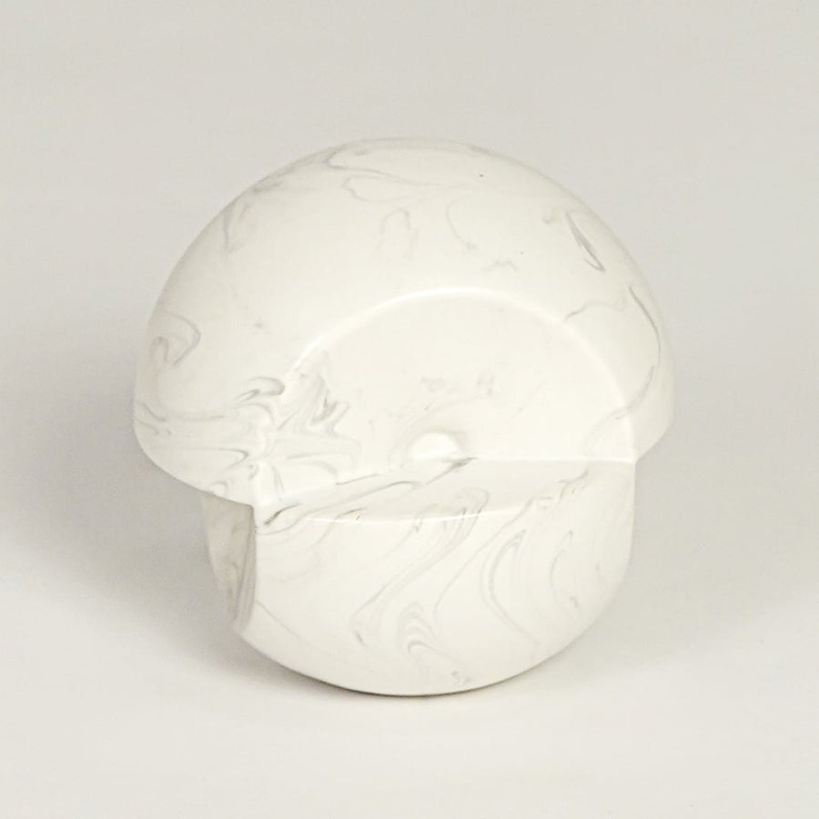 Modern white marble look ceramic statement decor piece with organic rounded silhouette for contemporary interiors.