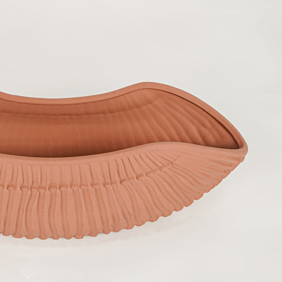 Terracotta ceramic decorative shell bowl with detailed textured surface perfect for elegant dining table centerpiece and console decor.