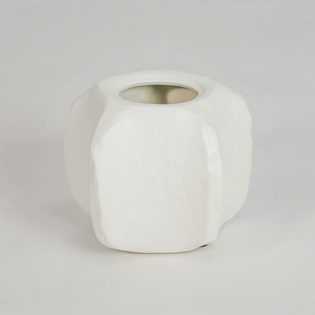 White background image of small white ceramic vase with lid for elegant tabletop decor styling and modern interior design.
