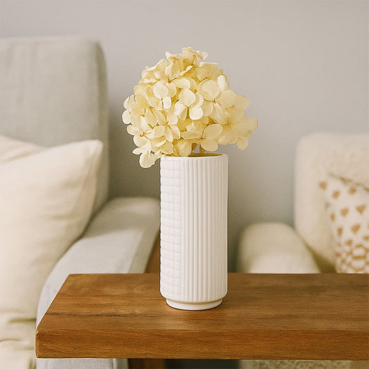 White ceramic textured vase styled for modern home decor ideal for shelves tables and minimal living spaces.