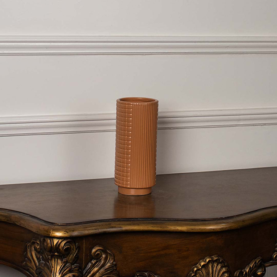 Terracotta textured ceramic vase displayed on a clean white background ideal for minimal home decor and tabletop styling.