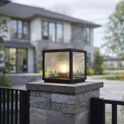 Black metal outdoor wall lantern with warm ambient glow for elegant patio lighting decor styling ideas.