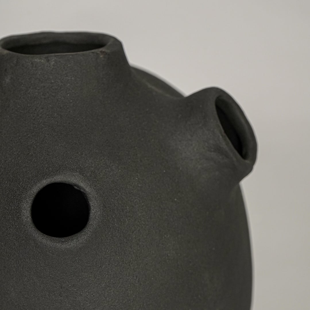 oddball black ceramic vase closeup