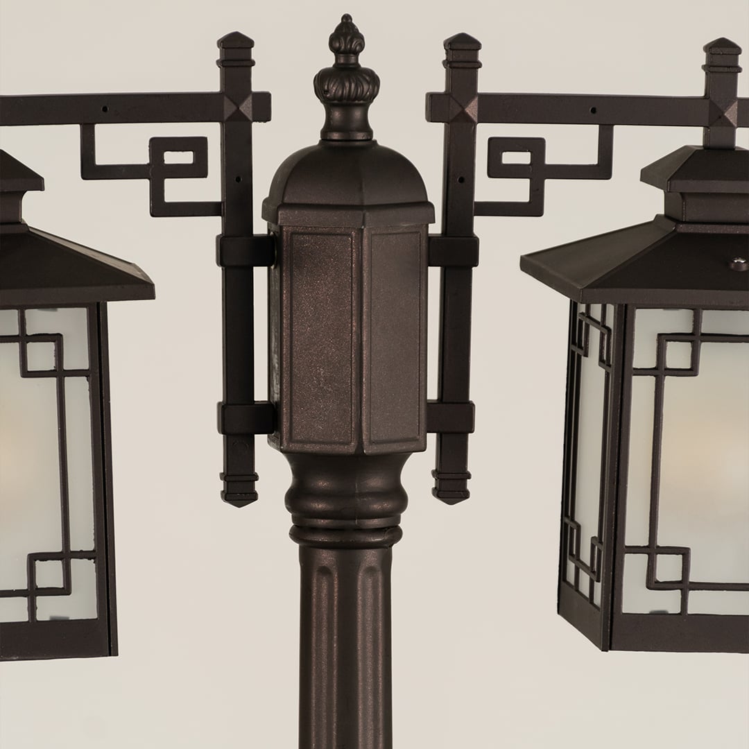 Closeup of vintage outdoor street lamp with geometric lantern detailing for luxury exterior decor use.