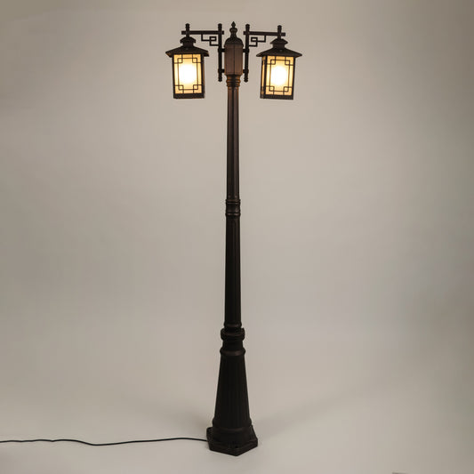 Vintage outdoor street lamp with dual glowing lanterns for elegant exterior decor styling use.