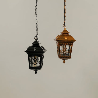 A pair of hanging lanterns with lights off highlighting their ornate frames and textured glass panels showing craftsmanship and design clarity without illumination.