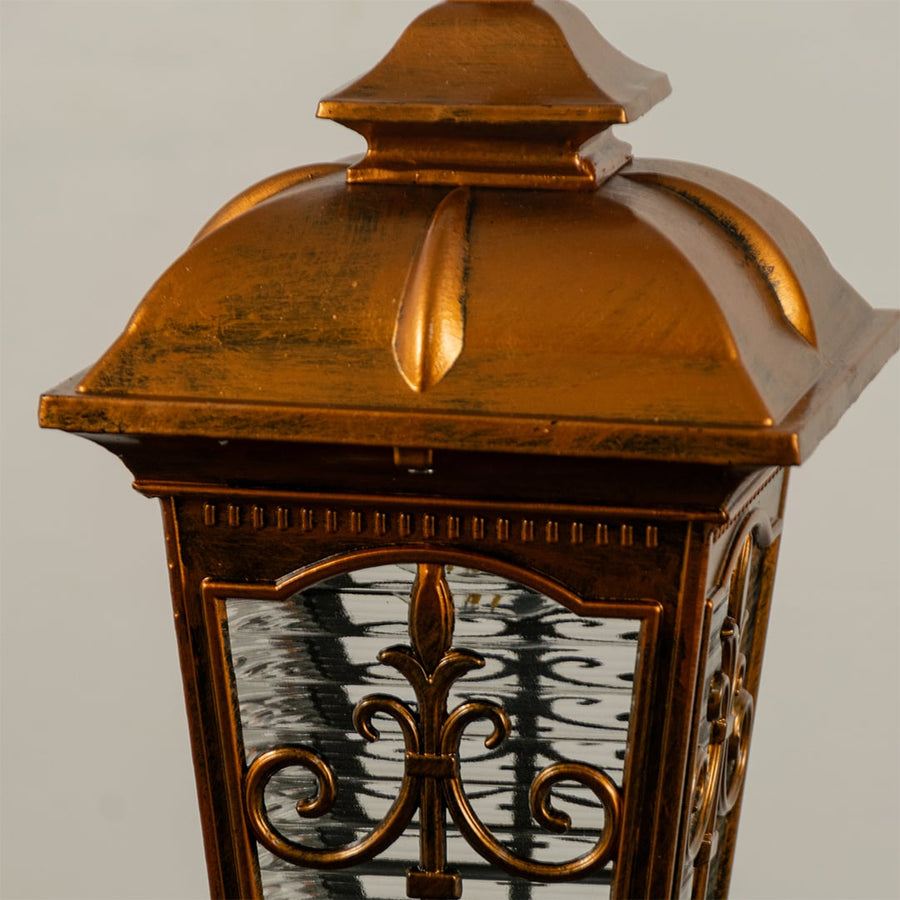 A closeup shot of the lantern without illumination showing the ornate metal frame textured glass panels and detailed craftsmanship in a clear view.
