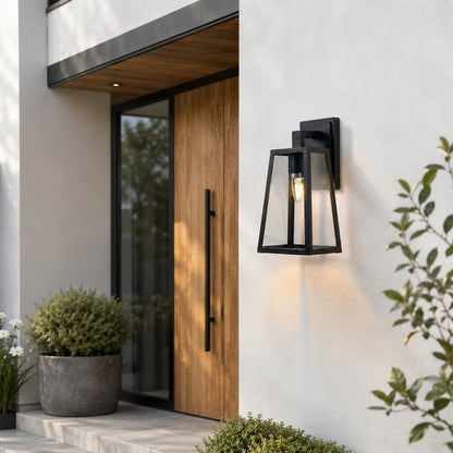 Black metal outdoor wall light lifestyle image beside wooden entry door for elegant exterior lighting decor.