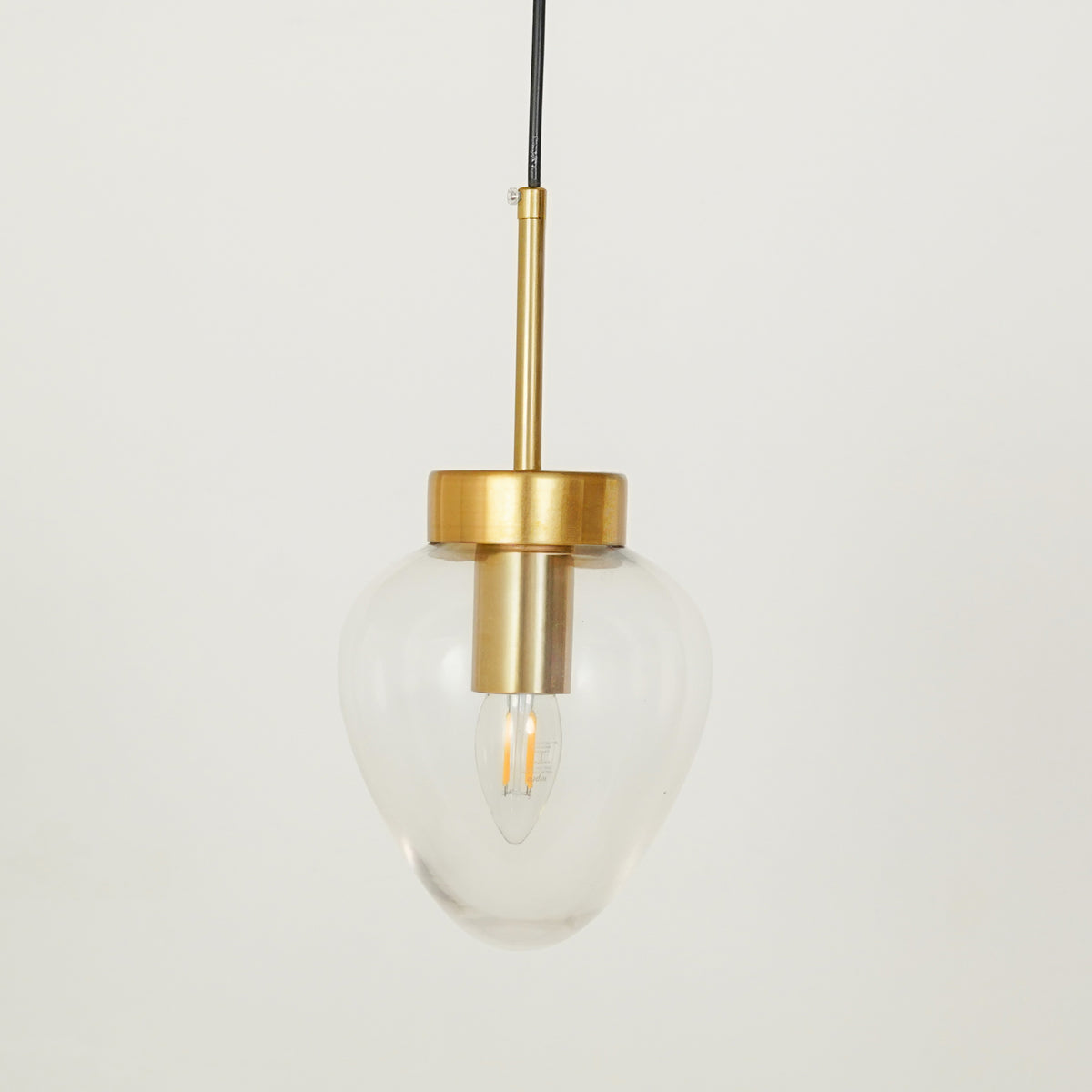 White background image of opulent shine clear glass pendant for modern living room decor styling with smooth clear finish.