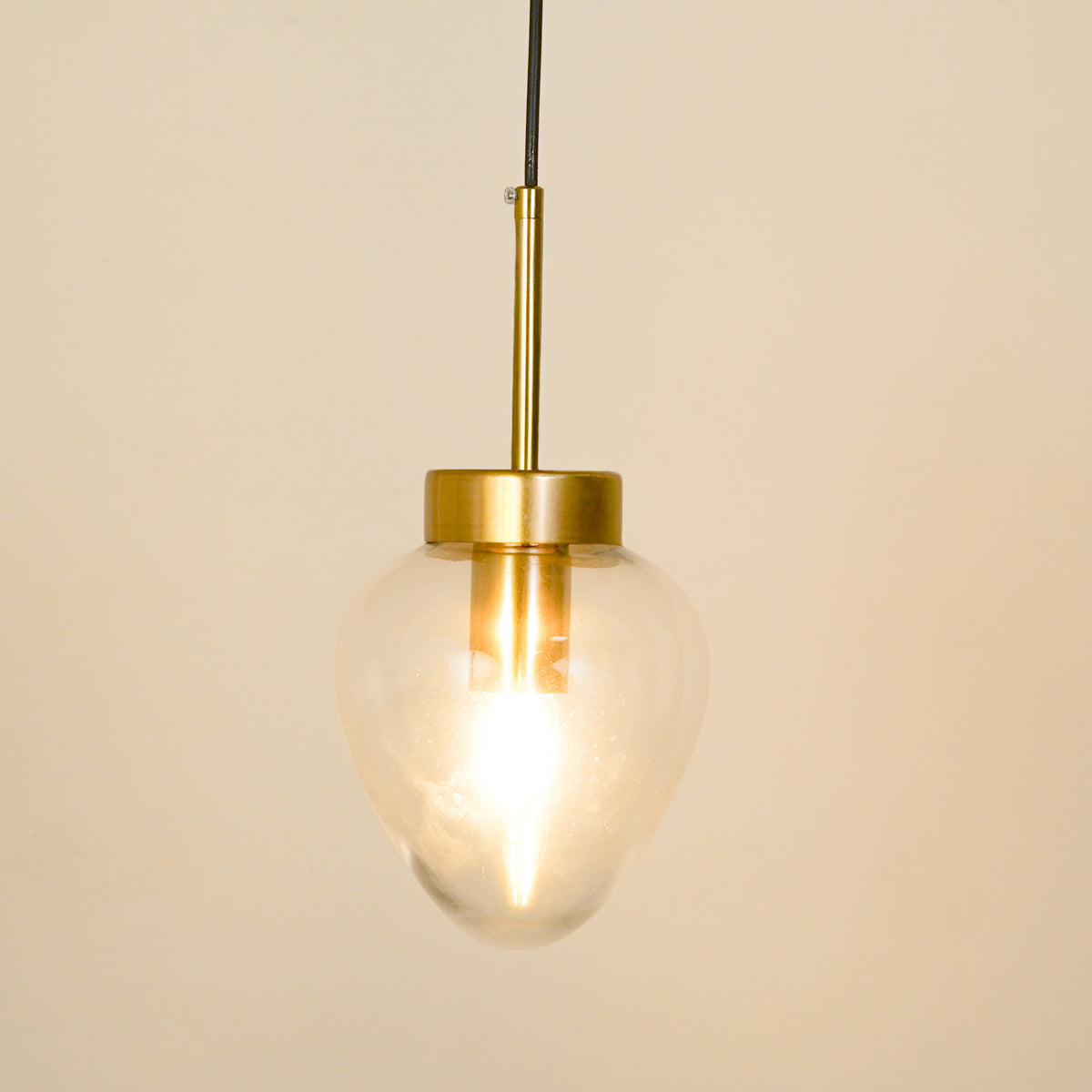 White background image of opulent shine clear glass pendant for elegant living room decor styling with bright illumination.
