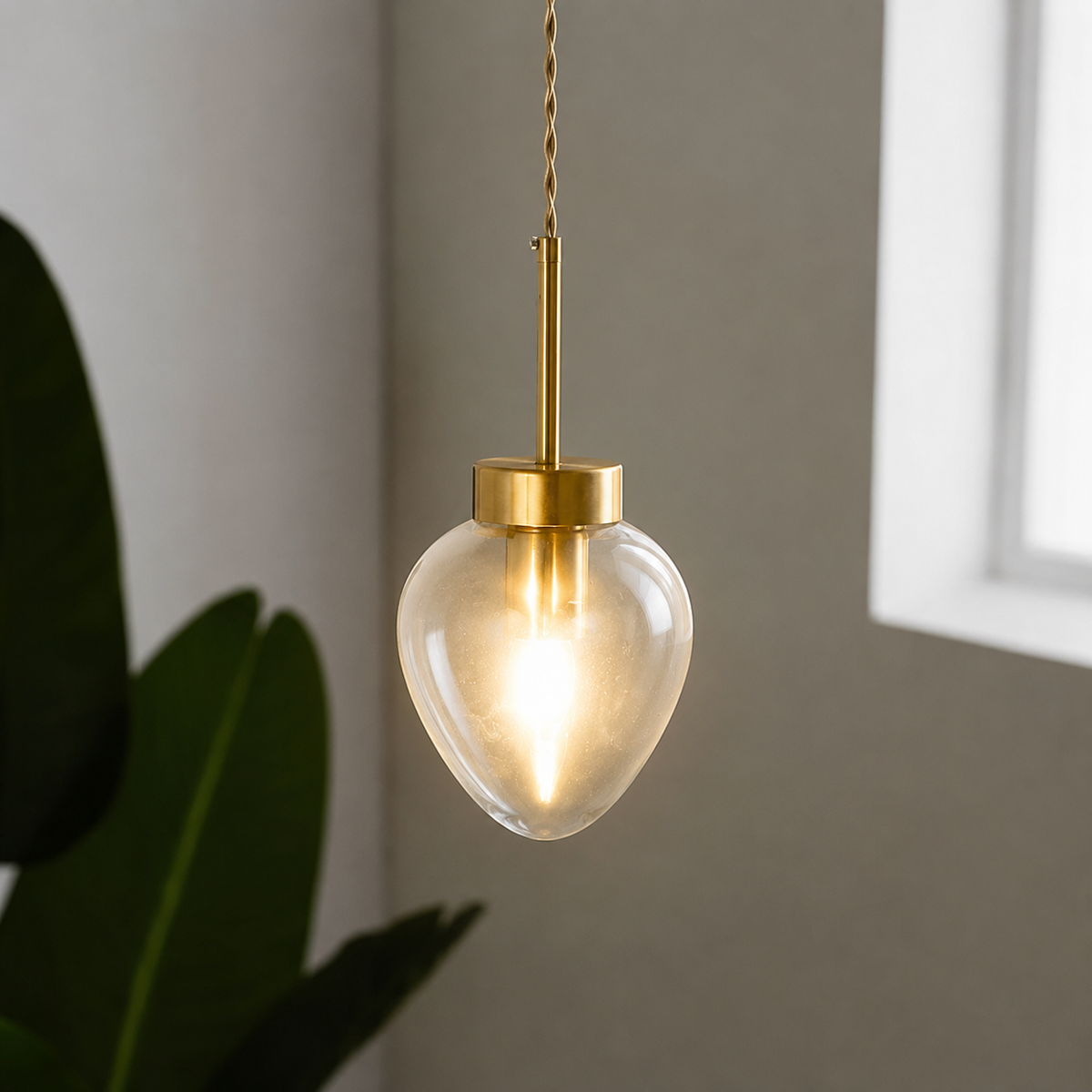 Lifestyle image of opulent shine clear glass hanging pendant for elegant living room decor styling with beautiful finish.