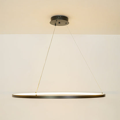 Contemporary slim linear pendant light with cable suspension hanging against clean white ceiling background ideal for modern home lighting.