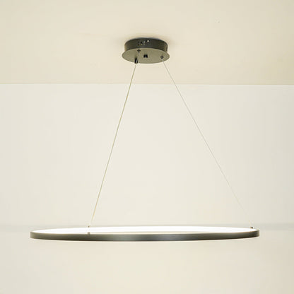 Minimal black linear pendant light with sleek design suspended by thin cables against white ceiling background perfect for modern interiors.