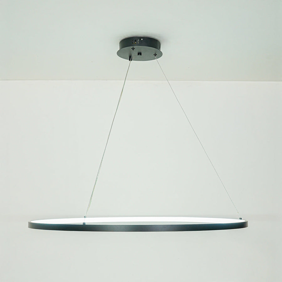 Elegant modern linear pendant light with slim profile hanging against neutral ceiling background ideal for contemporary dining or kitchen lighting.

