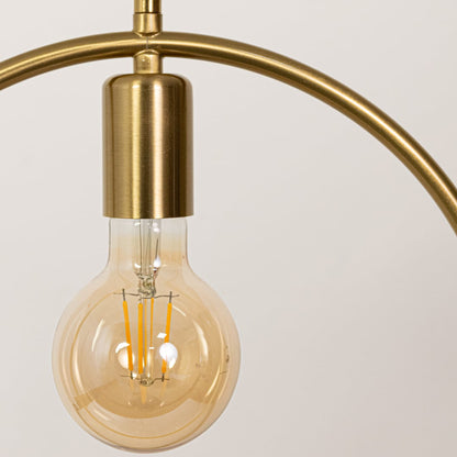Closeup of gold metal ring pendant light showcasing refined finish and modern craftsmanship.