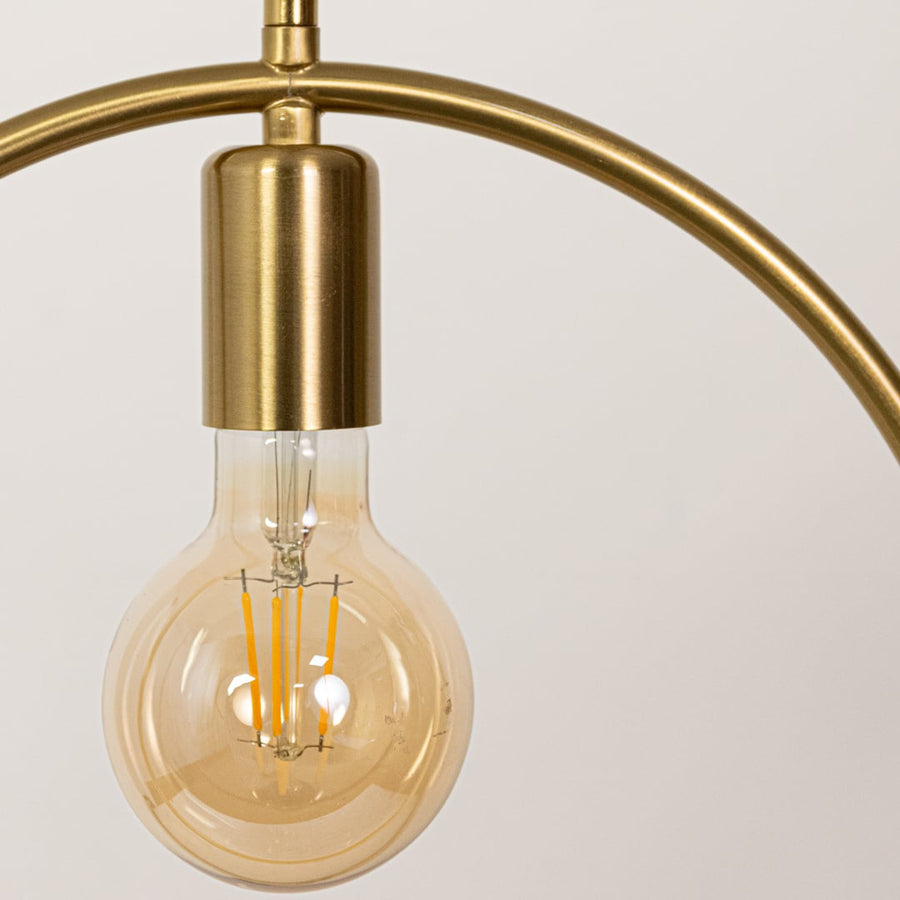 Closeup of gold metal ring pendant light showcasing refined finish and modern craftsmanship.