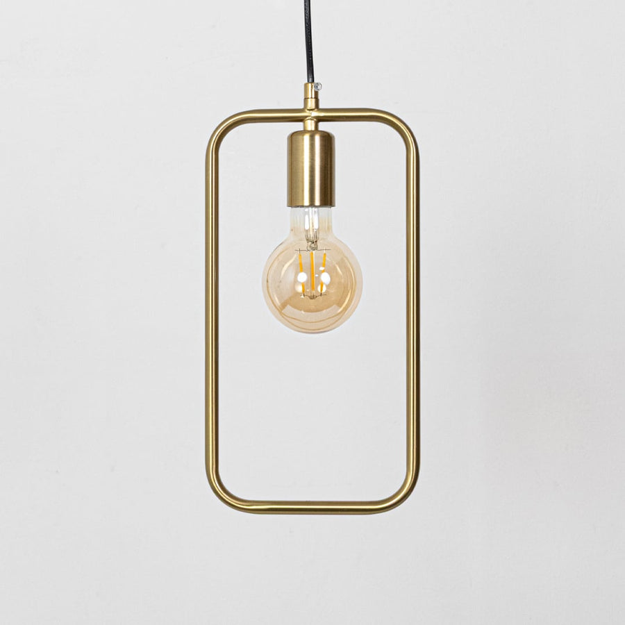 Amber glass and gold metal pendant light with rectangular frame for modern dining room decor.