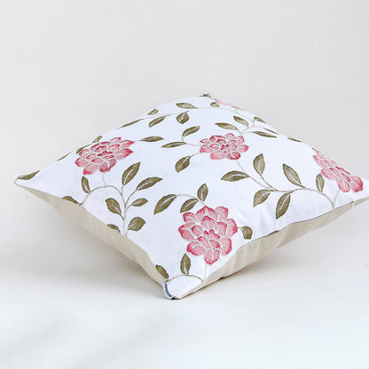 Side view of floral cushion cover with pink rose print leafy accents and soft fabric ideal for sofa decor use.