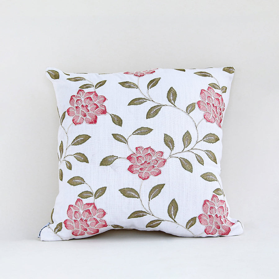 White cushion cover with soft pink floral vine print on smooth fabric designed for sofa chair and bed home decor styling.