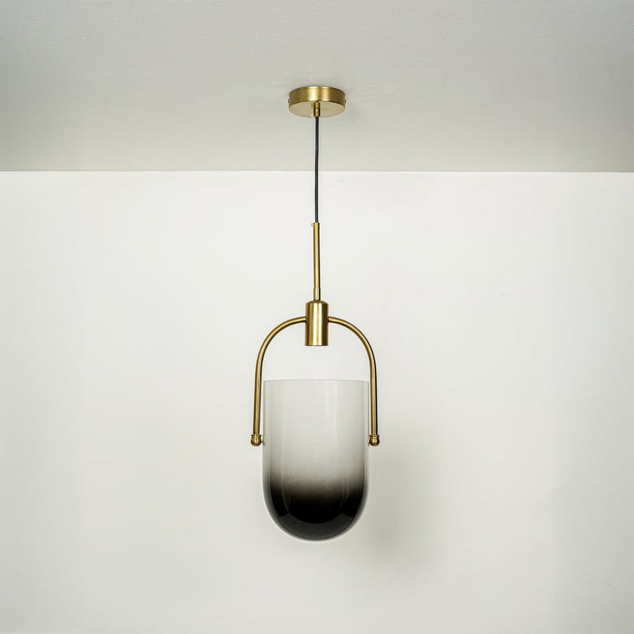 Minimalist frosted glass pendant light with polished gold fittings designed for stylish interiors.