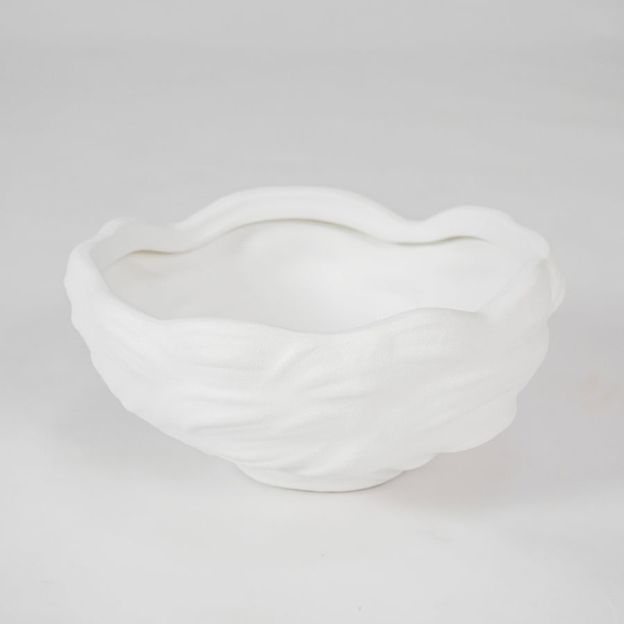 White sculptural ceramic planter bowl for stylish coffee table placement and minimalist indoor decor styling.