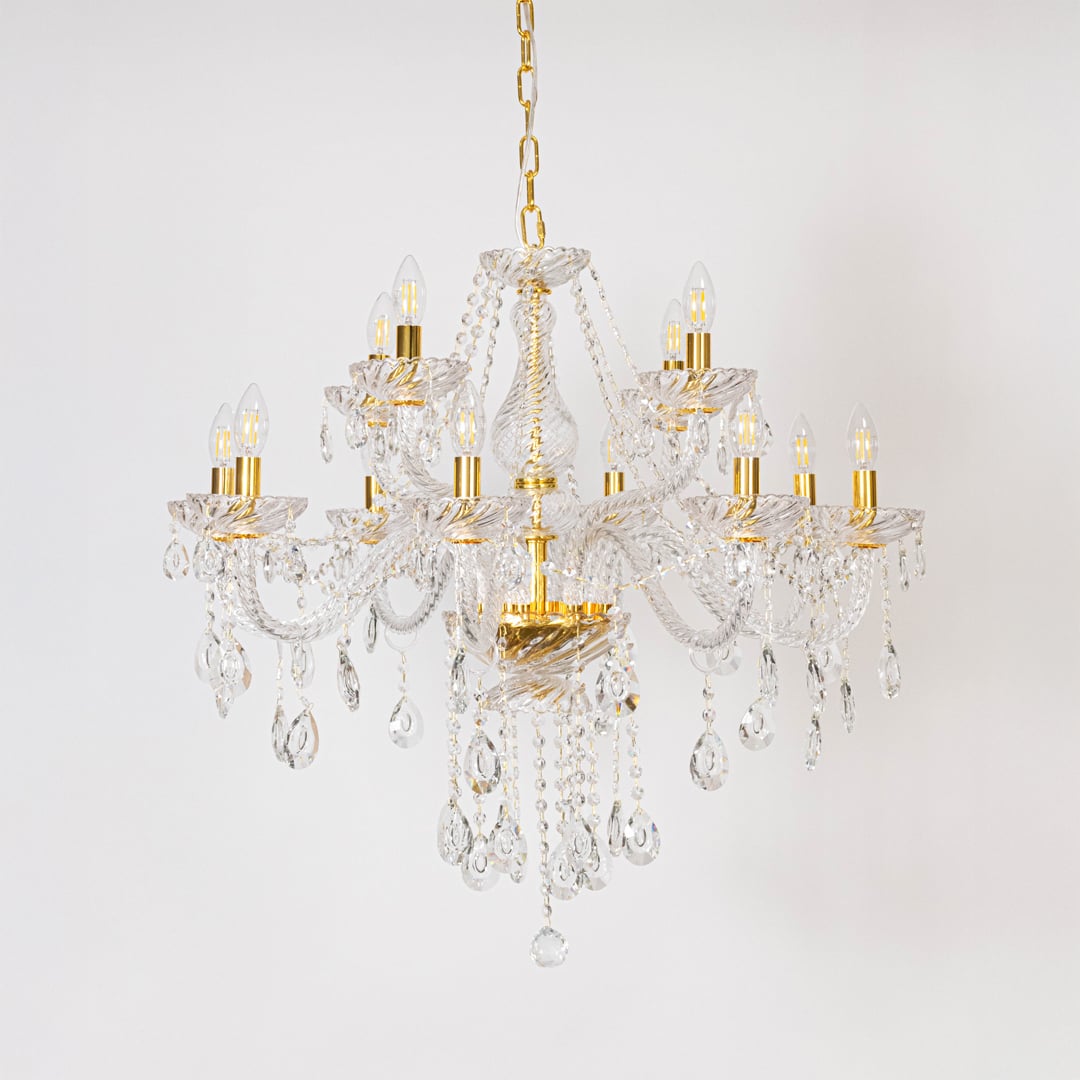 Classic chandelier with crystal detailing and gold finish displayed off on white background for stylish home lighting.