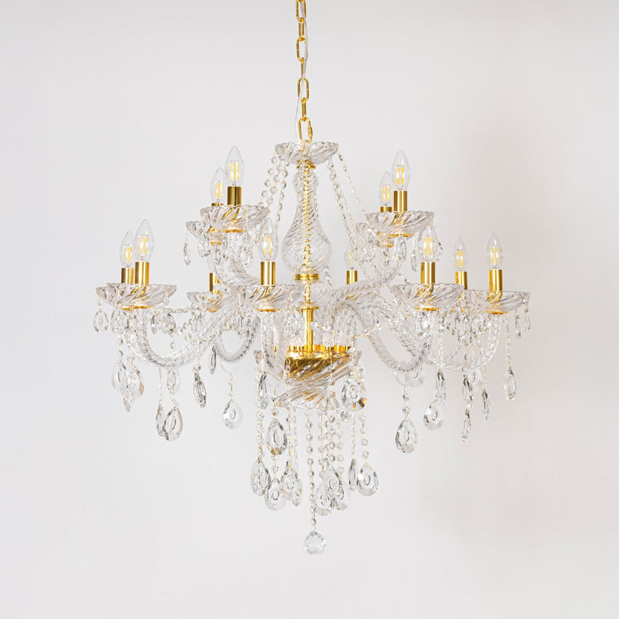 Classic chandelier with crystal detailing and gold finish displayed off on white background for stylish home lighting.