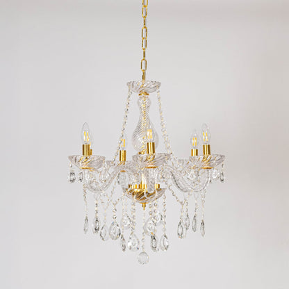 Classic chandelier with gold accents and crystal droplets displayed off on white background for luxury decor.