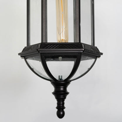Detailed closeup of black metal outdoor lantern with glass panels highlighting traditional craftsmanship and premium finish.