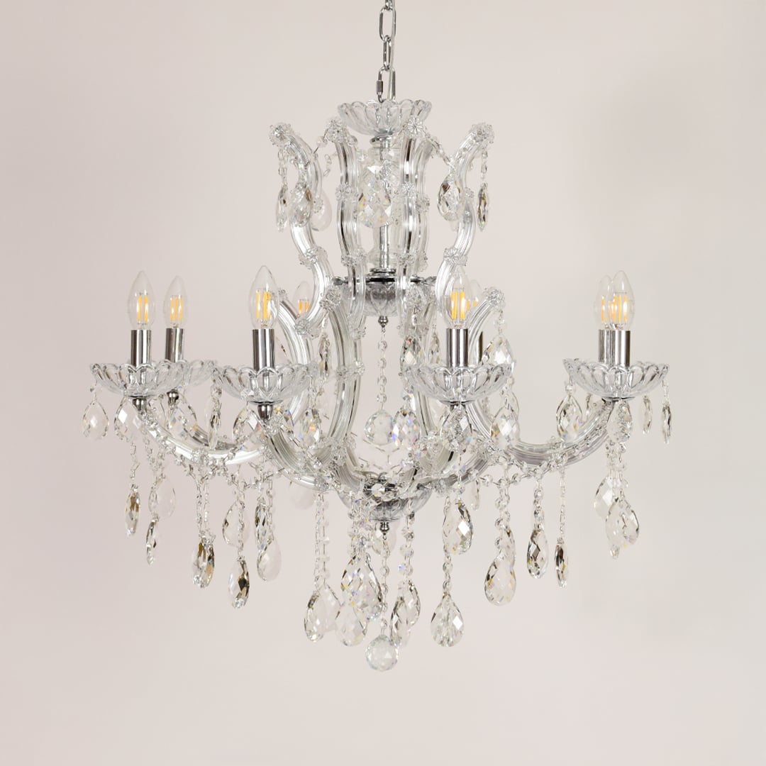 Crystal glass chandelier with chrome finish shown on white background for stylish modern home decor inspiration.