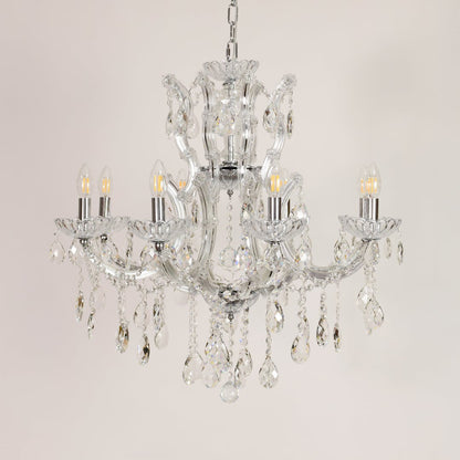 Crystal glass chandelier with chrome finish shown on white background for stylish modern home decor inspiration.