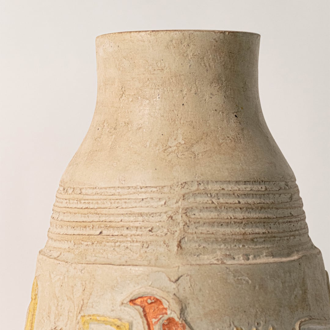 Close-up view of hieroglyph vase showing carved Egyptian-inspired patterns and handcrafted ceramic texture.