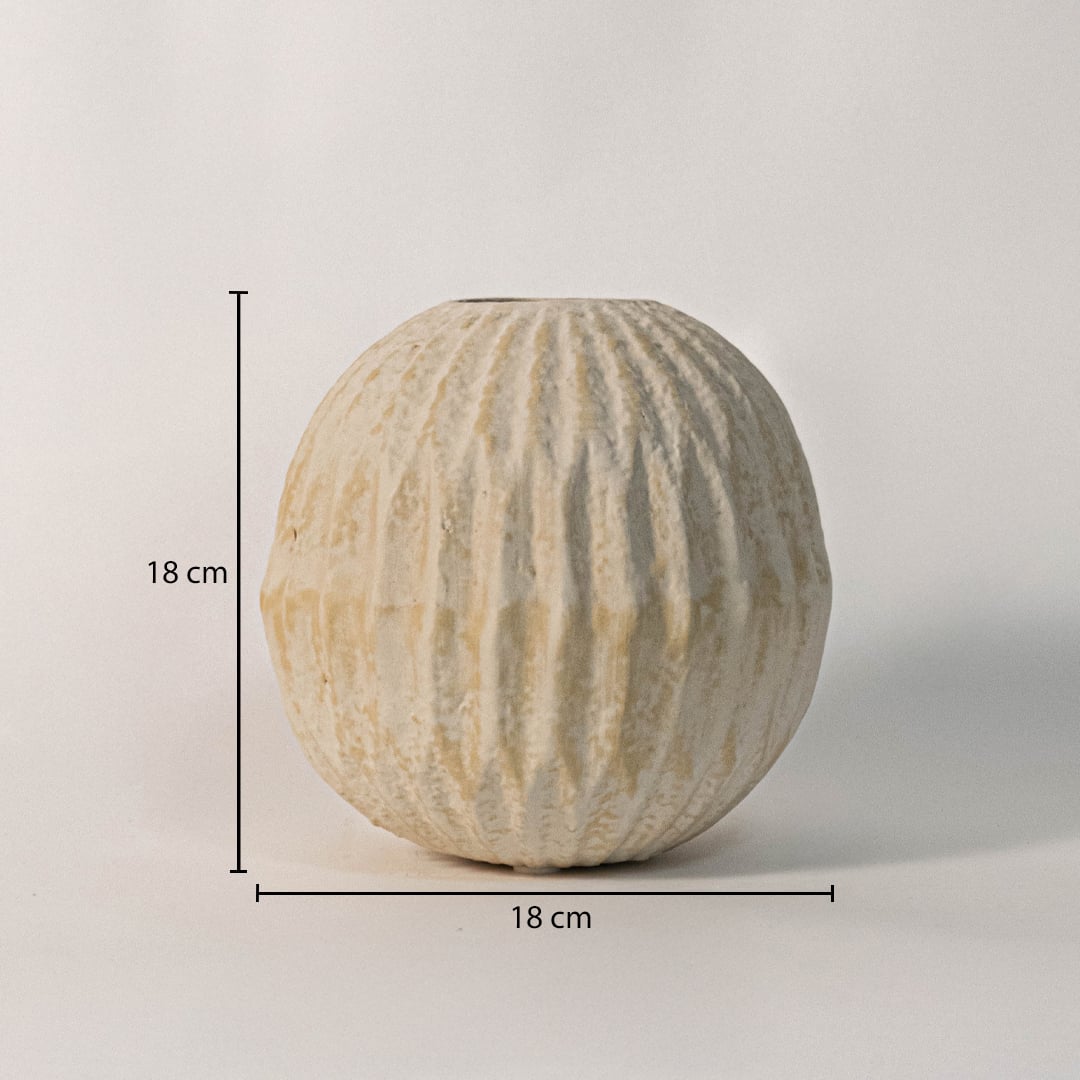 Round textured vase measuring 18 cm in height and 18 cm in width - ideal for fresh or dried flower arrangements.