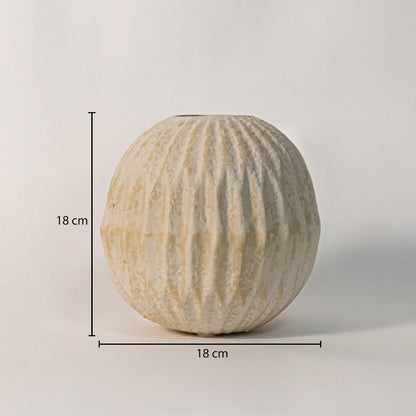 Round textured vase measuring 18 cm in height and 18 cm in width - ideal for fresh or dried flower arrangements.
