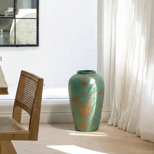 Lifestyle image of green ceramic floor vase for modern living room decor styling with textured artistic finish.