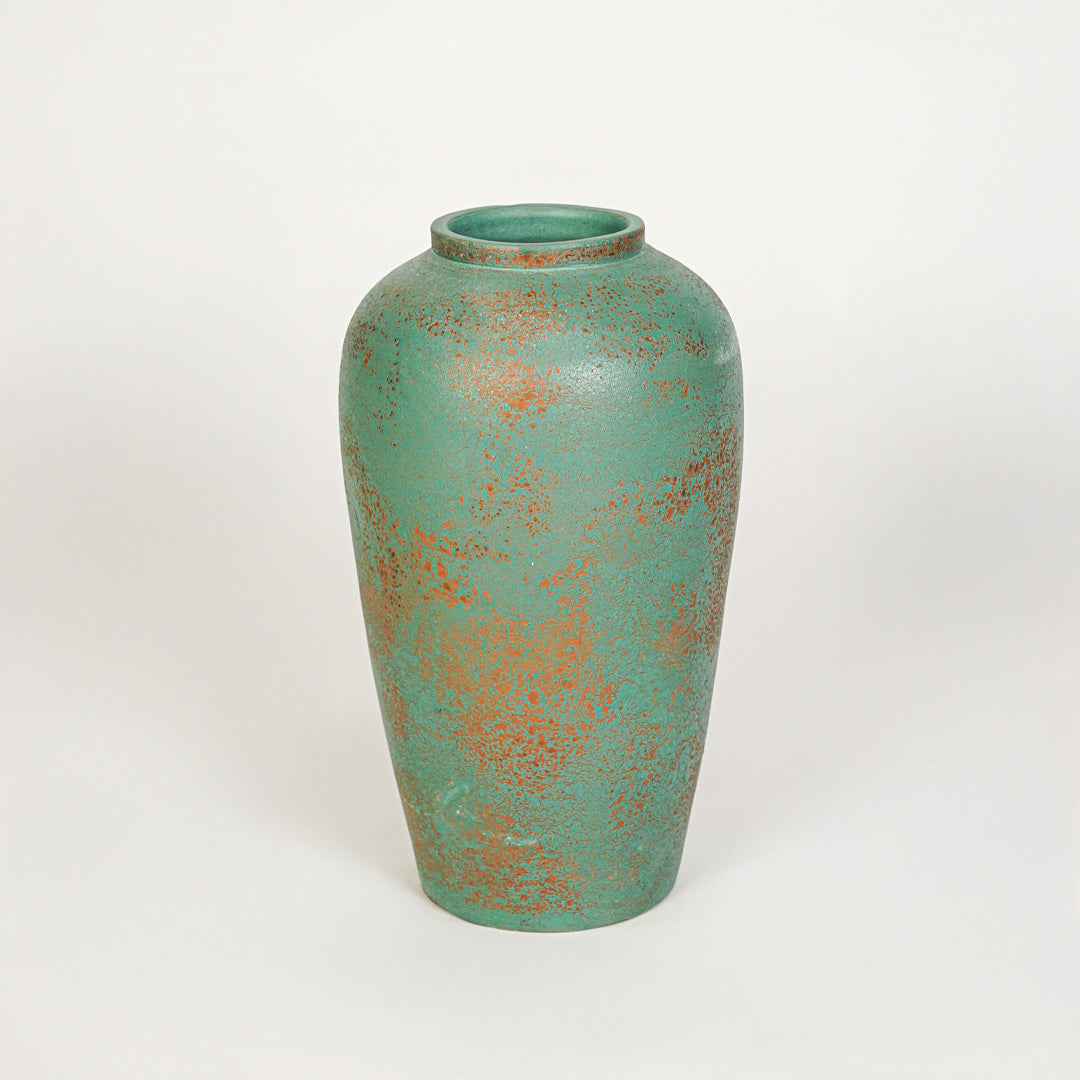 White background image of green ceramic decorative vase for elegant tabletop decor styling with textured finish.