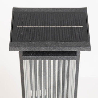 Closeup of solar garden light top displaying rectangular solar panel ribbed diffuser and durable outdoor lighting construction.