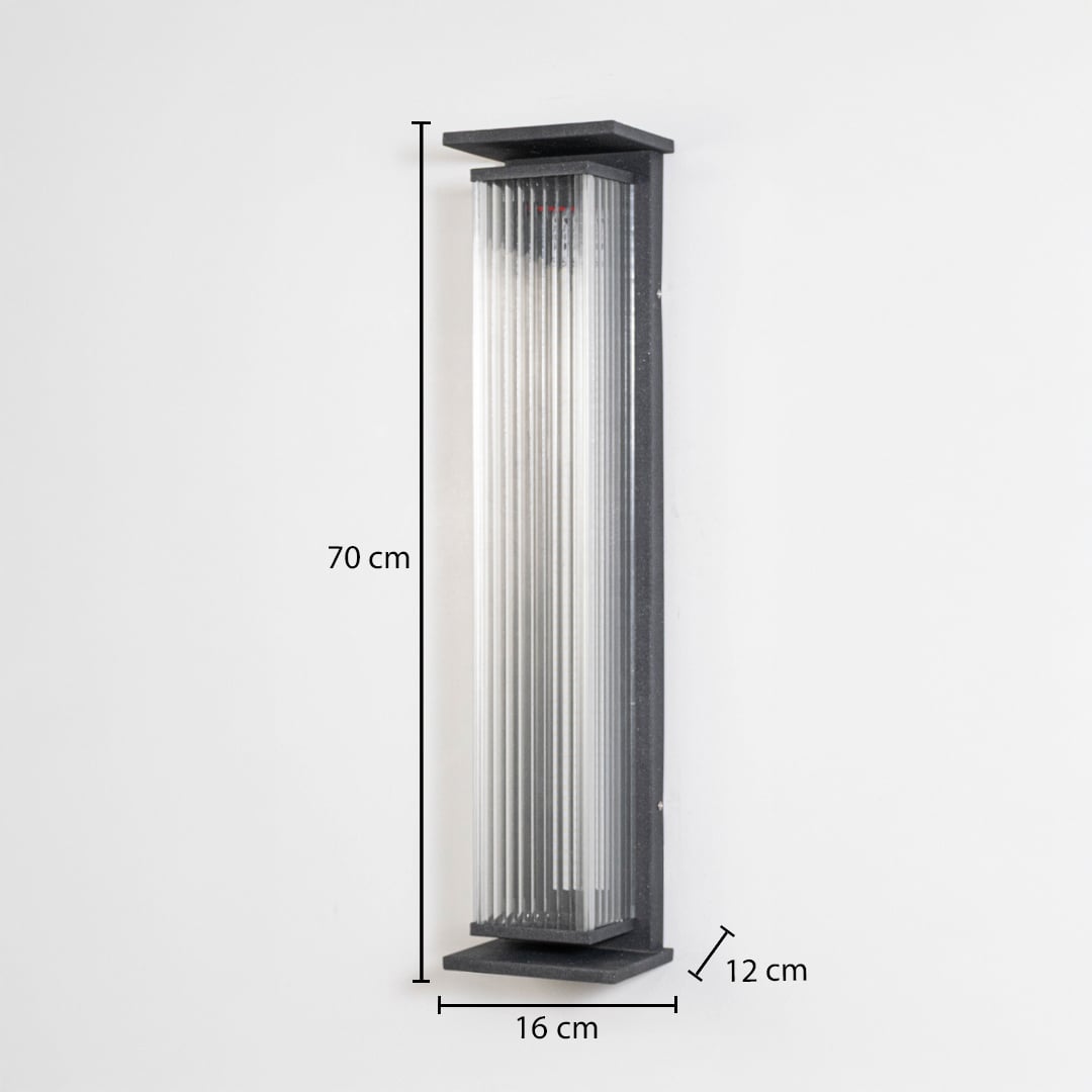 Modern outdoor wall light in black metal with ribbed glass mounted vertically showing 70 cm height 16 cm width and 12 cm projection.