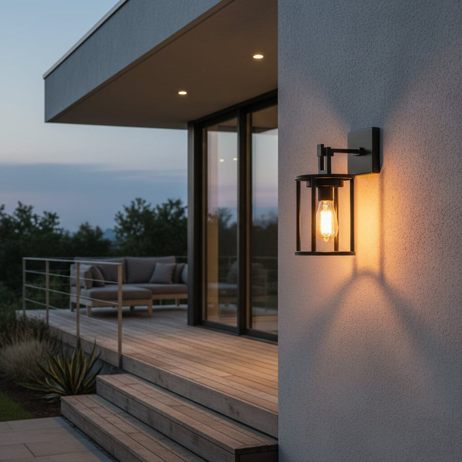 Black metal outdoor wall light lifestyle image with warm glow for modern patio and entryway wall decor.