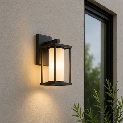 Black metal outdoor wall light lifestyle image with warm glow for elegant exterior entryway lighting decor.