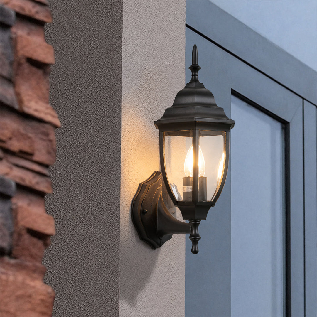 Black metal outdoor wall light lifestyle image beside modern doorway for elegant exterior lighting decor.
