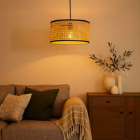 Woven rattan pendant light above bedside creating soft ambient lighting with rustic elegance.