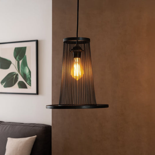 Tapered black wire pendant light adding industrial charm and soft illumination to elevate modern home interiors.