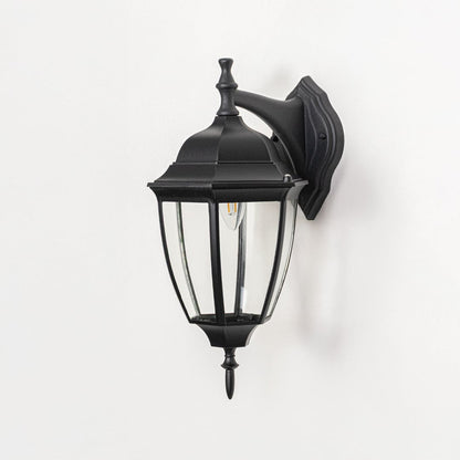 Outdoor wall lantern on white background highlighting black metal frame clear glass panels mounting plate and classic lantern form for product clarity.
