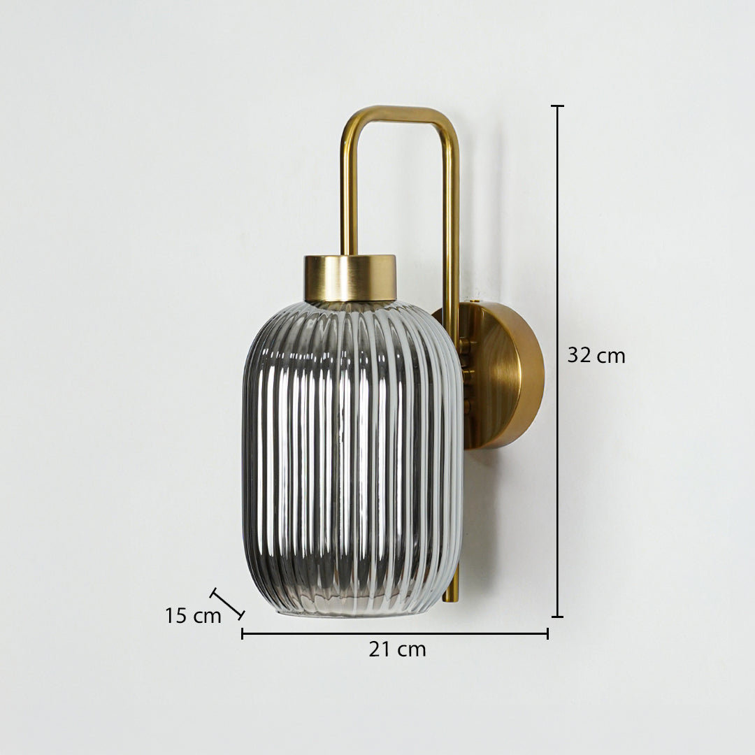 Gold metal wall light sized 32 cm height 21 cm width and 15 cm depth ideal for modern interior wall decor installation.