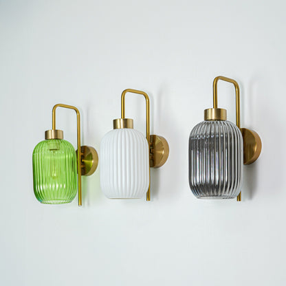 Set of gold metal wall lights with green white and smoked ribbed glass shades perfect for modern bedroom or hallway wall decor.