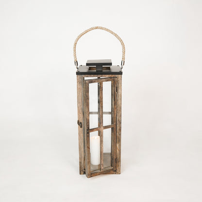 Wooden lantern with a candle inside on a white background