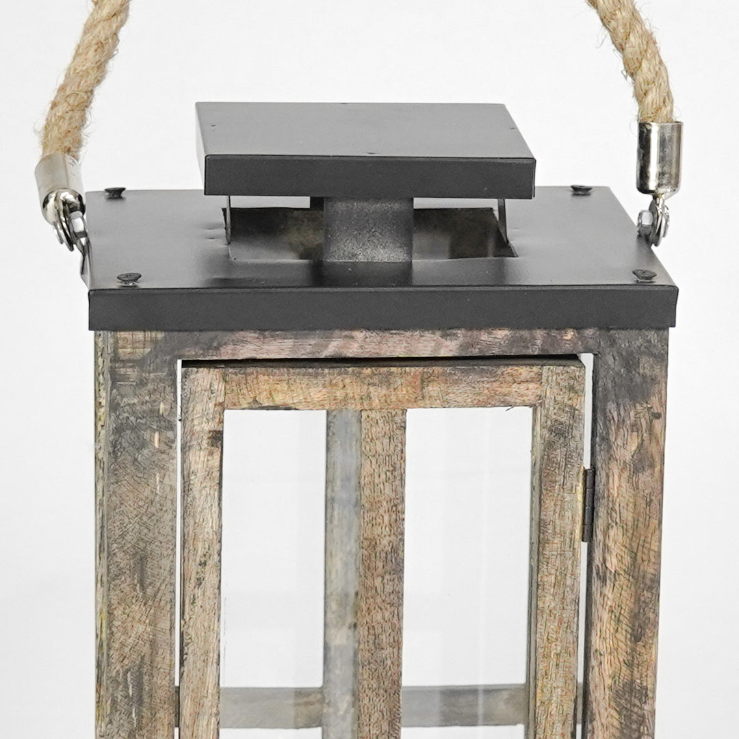 Wooden lantern with metal top on a white background