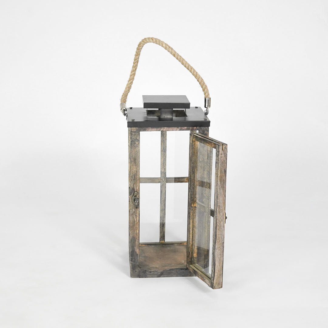 Wooden lantern with a rope handle on a white background